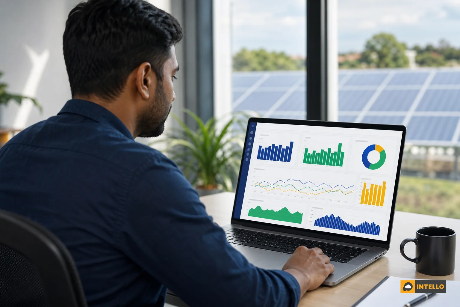 Engineer reviewing a multi-site solar performance dashboard on a laptop with charts showing performance ratio across several sites. Photorealistic photo of an Indian solar operations engineer sitting at a desk, viewing a laptop screen
